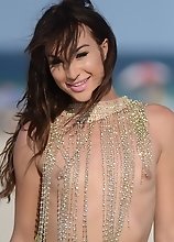 Adorable tgirl Jonelle posing on the beach