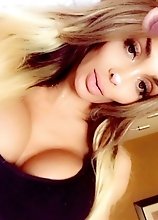 EXAGERATEDLY BUSTY blonde shows off her enormous attributes
